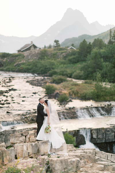 groom kissing bride on forehead