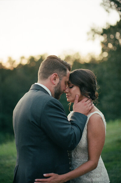 bride and groom share romantic moment on their wedding day on film