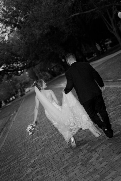 Romantic close-up of newlyweds embracing in soft backlight, styled and shot by a luxury Florida wedding photographer with a documentary approach