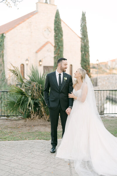 Bride and groom embracing during their outdoor wedding portraits in Tennessee, captured by Nashville wedding photographer Diana Marie.
