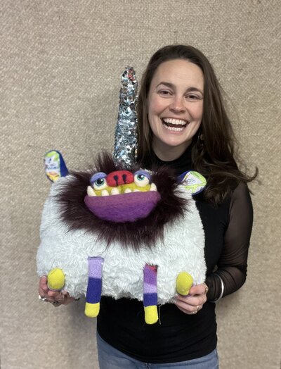 Natalie holding eco friendly plush sculpture