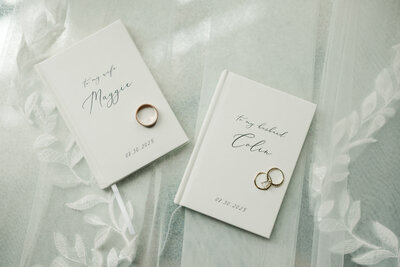 Vow books and wedding rings photographed by Claire Katan Creative.