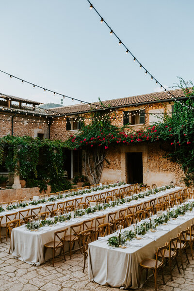 Beautiful ceremony set up of chair with greenery