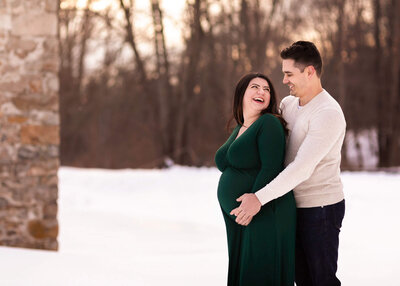 NJ maternity photos of couple in the snow