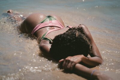 lying-on-beach-in-bikini