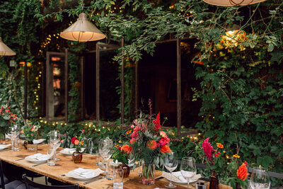 Elegant table setting with floral centerpieces at Kellen and Paul's New York City wedding dinner celebration.