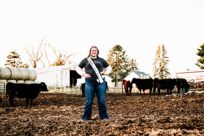 Girl smiling in barn on bleachers
