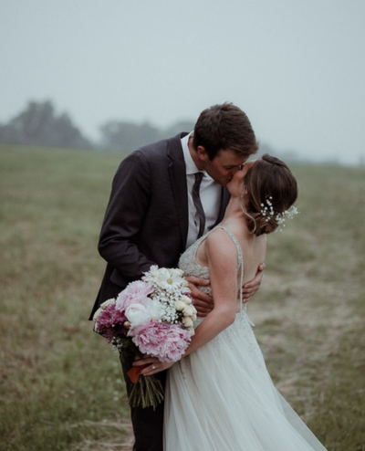 Couple embracing during their rustic elopement in northern Vermont