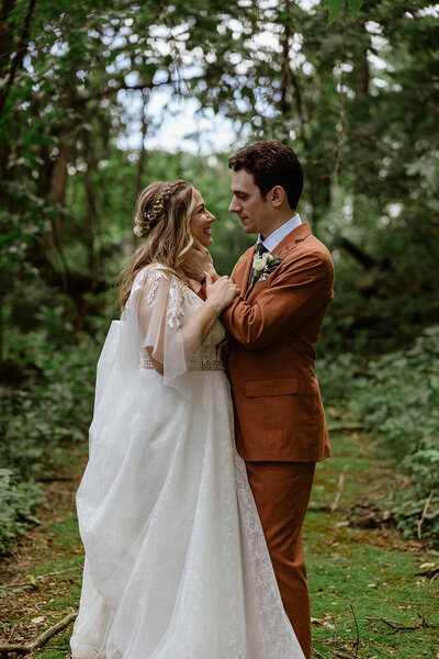bride and groom embrace for portraits after wedding ceremony in lancaster pa