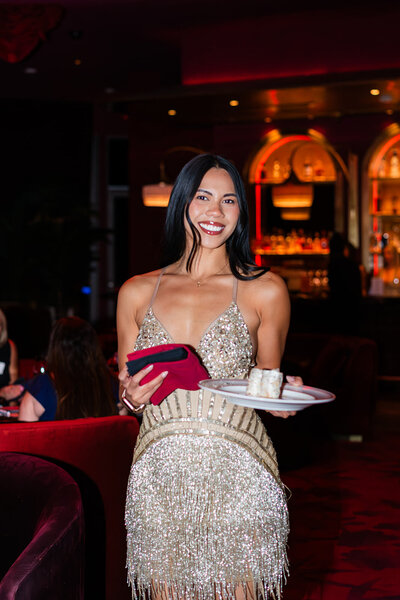 girl poses with dessert during las vegas business event