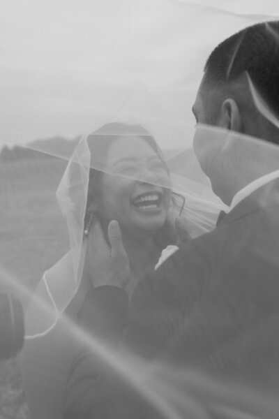groom cuddling into brides temple on wedding day