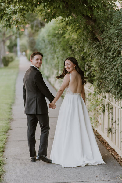 Wedding Couple Walking holding hands in Calgary