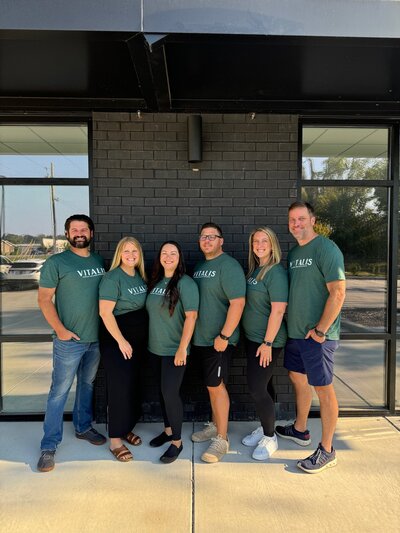 Vitalis wellness community team standing together at Mount Juliet studio for monthly wellness event