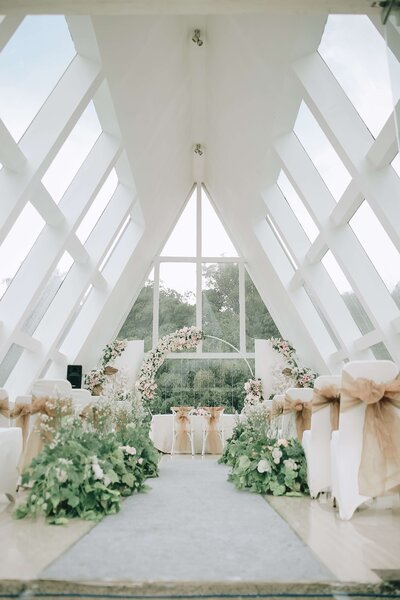 Coastal wedding decor setup featuring romantic floral bouquets