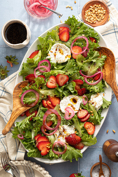a salad with fresh strawberries