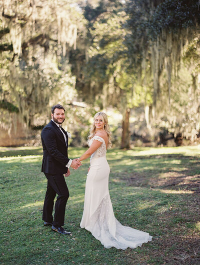 Romantic First Look at Middleton Place with loose wave bridal hair captured by Anne Rhett Photography