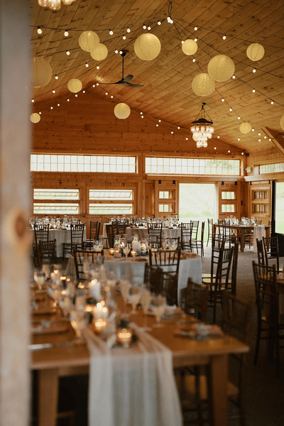 Locke Halls Farm - Indoor Wedding Reception with Tables and Chairs Set and Hanging Lights