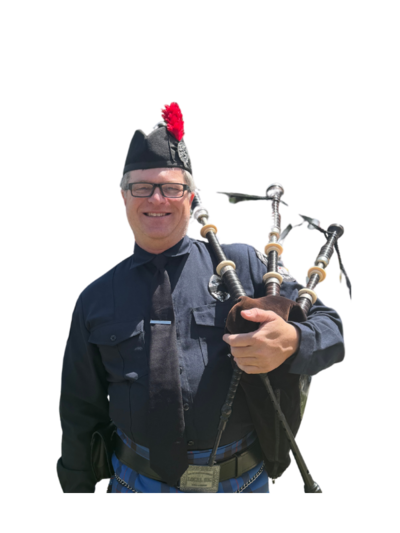 Chris Bowden, Treasurer of Local 935 Pipes and Drums, standing proud with pipes—and probably a budget spreadsheet nearby.
