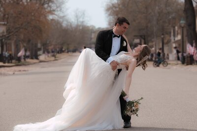 Groom dips his wife on the streets of Colonial Williamsburg