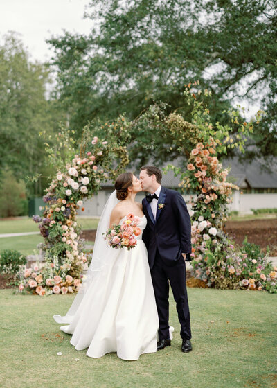 Bride and Groom Kissing Photo