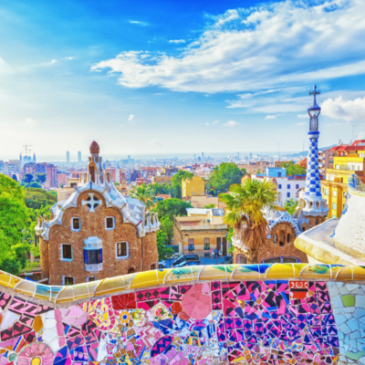 The colorful Park Guell in Barcelona, Spain featuring Gaudi's rainbow mosaic tiles and architecture