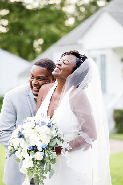 Bride and groom laughing together