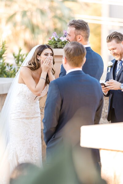 Phoenix-Wedding-Photographer-and-Videographer-Bride-laughing-during-ceremony-VosWed-1707