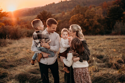Family-photographer-lehigh-valley-pennsylvania maternity session, mom and dad with boho backdrop in allentown PA