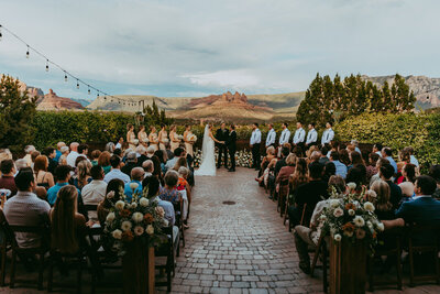 bride and groom smiling at enchantment resort in sedona
