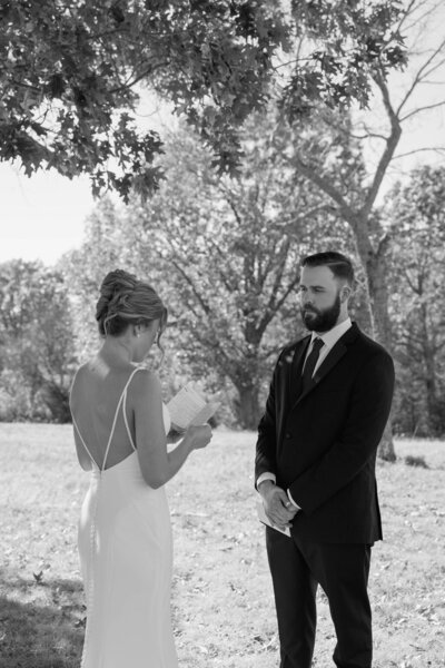 Bride reading her vows to the groom 