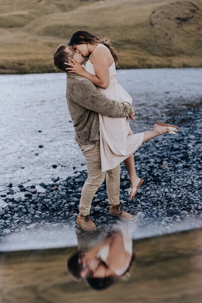 Iceland Wedding Photographer captures man lifting woman