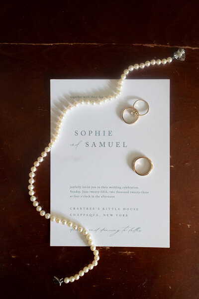 An antique table at Crabtree's Kittle House serves as the backdrop for a still life of Sophie's wedding jewelry 