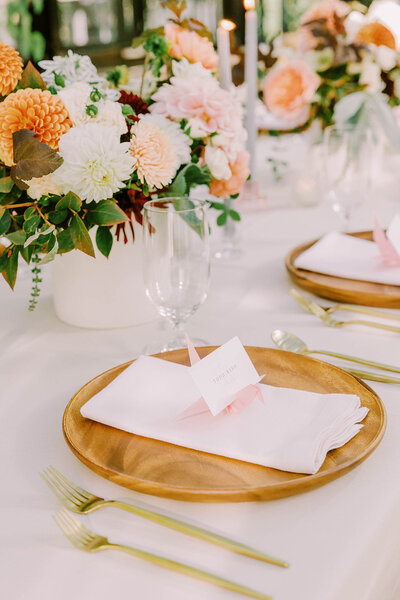 Elegant wedding cake and candle display at a Seattle wedding, coordinated by Wander Event Co. through event management services.