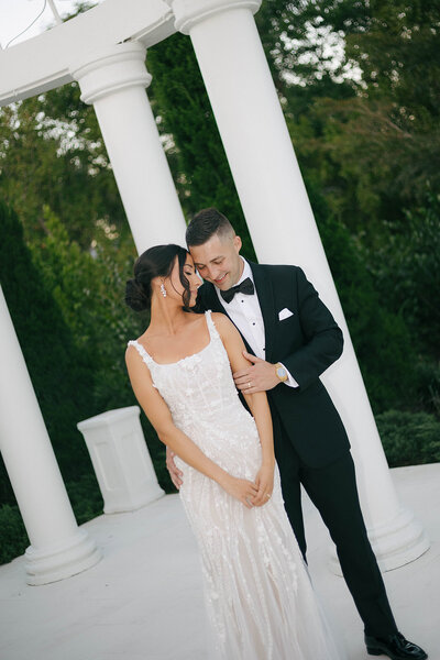couple celebrating just getting married by the water in jupiter florida at the pelican club