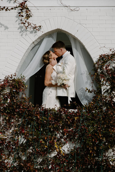 Bride and groom sharing a romantic moment in luxurious Texas setting