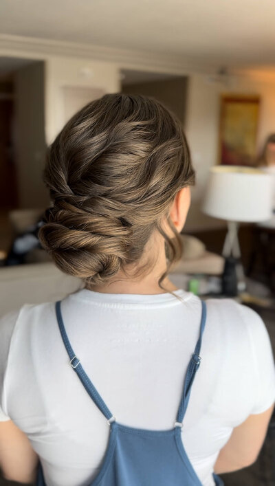 Bride with a classic low bun — timeless, elegant wedding hairstyle created by Klover Beauty for a Maryland bride.