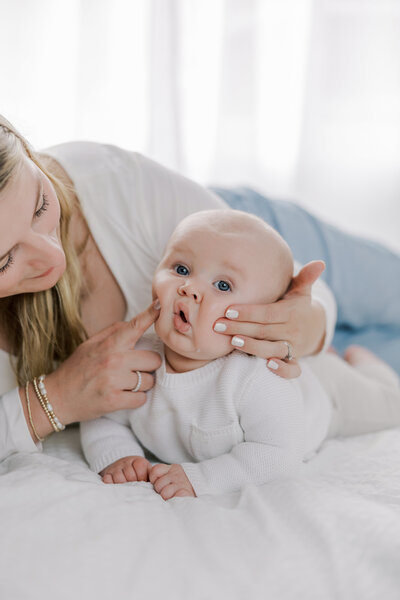 A mother and her children smile at the camera in a fall family session in Richmond, VA.