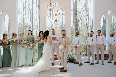 Couple during their wedding ceremony in North Carolina saying vows and laughing with each other