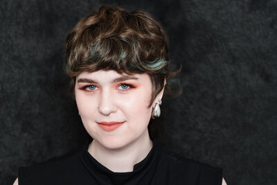 headshot of a green eyes woman