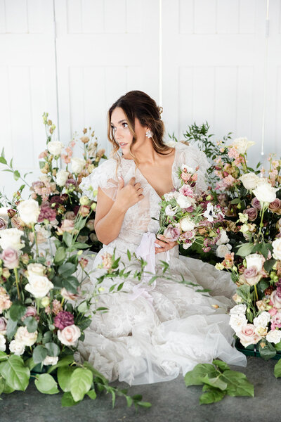 Bride in flowers at Ohio wedding venue captured by The Cannons photography Ohio wedding photographers