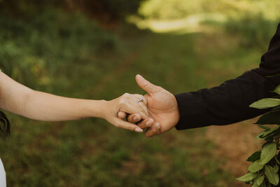 Bride and groom holding hands