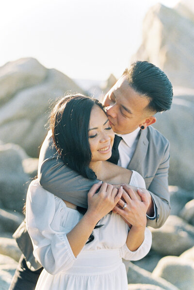 San Francisco wedding day bride and groom pose for portraits on the beach