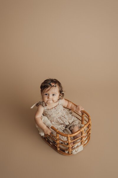 girl in crate during milestone session in st. pete