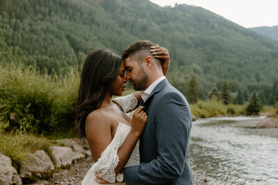 photo of bride and groom smiling at each other taken by Elopement photographer in Colorado