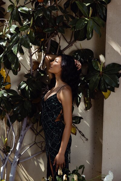 Senior photographer in Los Angeles capturing confident teen girl in beaded prom dress in natural sunlight 

