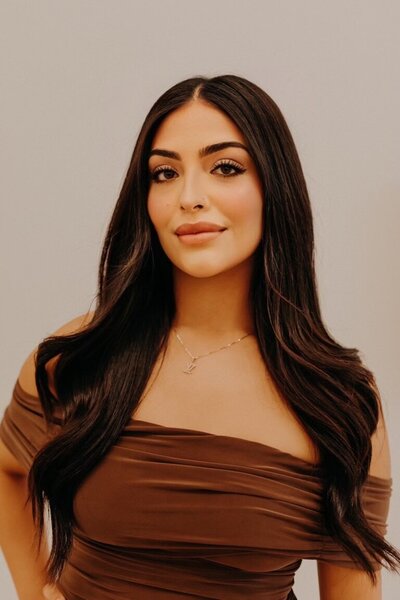 Bakersfield real estate agent photo in brown off the shoulder top
