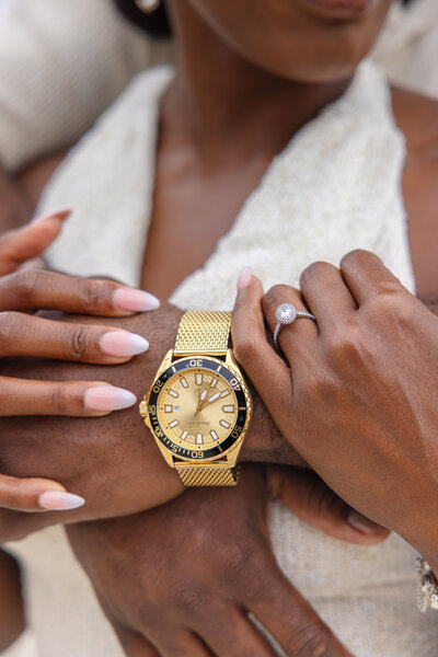 Close-up of bride’s engagement ring with groom’s hands, highlighting their connection and love, Virginia engagement photography