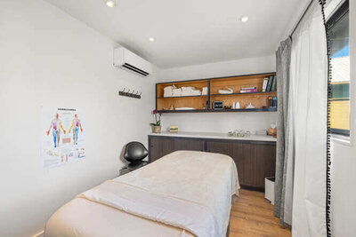 Wellness appointment room with treatment table and soft lighting