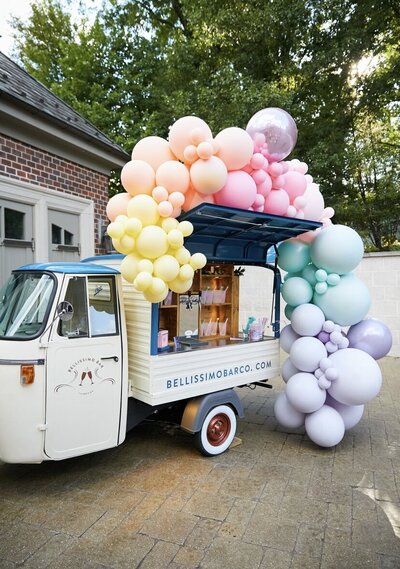Mobile bar with balloons set up for wedding