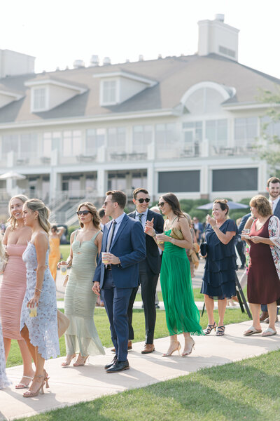 Wedding guests walking to their seats at an outdoor Madison wedding ceremony.